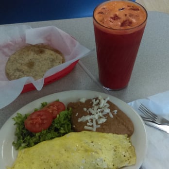 100% Natural - a plate of food and a drink - Salad Near Me - Brownsville, Texas 100% Natural - a plate of food and a drink - Salad Near Me - Brownsville, Texas
