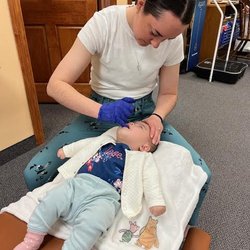 Prior Lake Chiropractic - Dr. Montana Belford adjusting an infant at Prior Lake Chiropractic