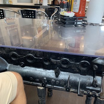 Obi's Fillin Station - Tables are made of engine parts.. interesting! - American Near Me - Saint Augustine, Florida