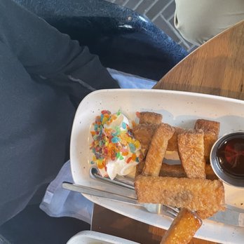 The Pool Club - The "fruity pebbles" French toast aka sad French toast sticks with fruity pebbles on whipped cream. - Bars Near Me - Nashville, Tennessee The Pool Club - The "fruity pebbles" French toast aka sad French toast sticks with fruity pebbles on whipped cream. - Bars Near Me - Nashville, Tennessee