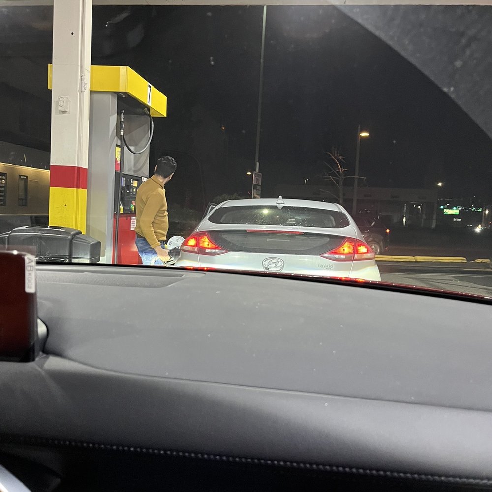 Meridian Super Mart - a man filling up his car at a gas station - Convenience Stores Near Me - Bellingham, Washington Meridian Super Mart - a man filling up his car at a gas station - Convenience Stores Near Me - Bellingham, Washington