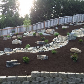 New Dimension Lawn & Landscape - This used to be a brown, depressing area looking out from our living room and deck areas. - Landscaping Near Me - Puyallup, Washington New Dimension Lawn & Landscape - This used to be a brown, depressing area looking out from our living room and deck areas. - Landscaping Near Me - Puyallup, Washington