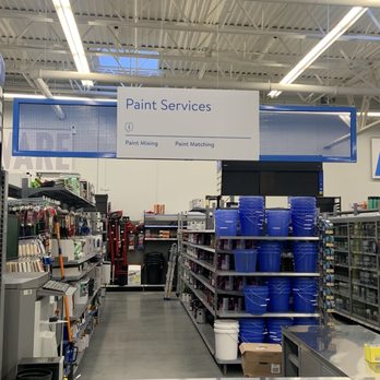 Walmart Supercenter - the inside of a store with shelves of paint - Grocery Near Me - Yaphank, New York