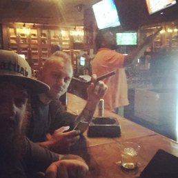 two men sitting at a bar two men sitting at a bar