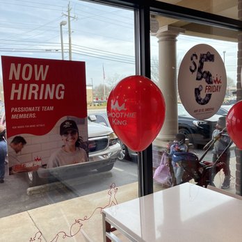 Smoothie King - red balloons on a table in front of a window - Juice Bars & Smoothies Near Me - Covington, Georgia