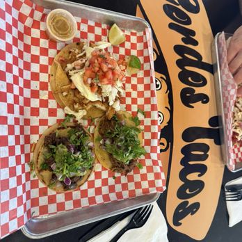 Gordos Tacos - The big one is the Nashville Chicken. Also pictured are the Classic Birria Taco and the Carne Asada Taco - Tacos Near Me - Chandler, Arizona
