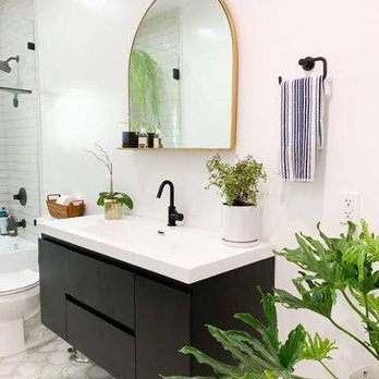Elcano Construction - a bathroom with a sink, toilet, and shower - General Contractors Near Me Elcano Construction - a bathroom with a sink, toilet, and shower - General Contractors Near Me