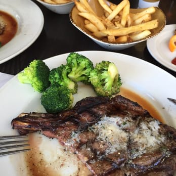 Hard Rock Cafe - Cowboy ribeye with seasoned French fries and broccoli - Burgers Near Me - Honolulu, Hawaii Hard Rock Cafe - Cowboy ribeye with seasoned French fries and broccoli - Burgers Near Me - Honolulu, Hawaii