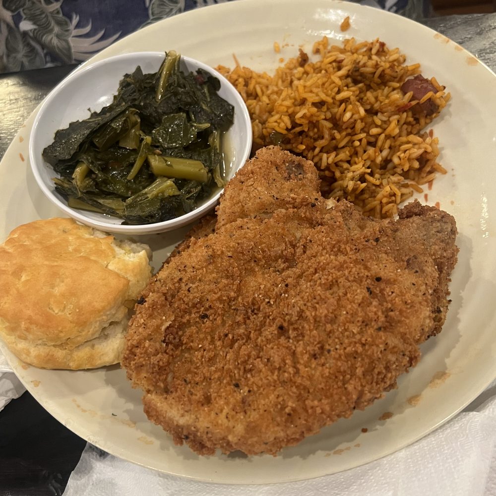 Rivertown Bistro - Red rice, pork chop, greens and biscuit - New American Near Me - Conway, South Carolina Rivertown Bistro - Red rice, pork chop, greens and biscuit - New American Near Me - Conway, South Carolina