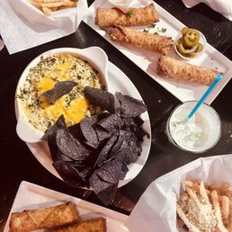 Parmesan truffle, bbq brisket egg rolls, and spinach and artichoke dip. Parmesan truffle, bbq brisket egg rolls, and spinach and artichoke dip.
