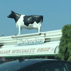 Cheese Store & More - The cow on the roof proves it has fresh cheeses