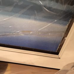 FedEx Office Print & Ship Center - Backing and painting totally separated from frame. Glass shifted and scratching art, can't move it without scratching the art more.