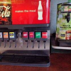 Flame Burger Plus - Self service drink station serving Coke products.