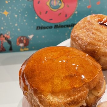 Disco Biscuits - three doughnuts on a white plate - Donuts Near Me Disco Biscuits - three doughnuts on a white plate - Donuts Near Me