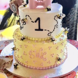 A custom made 1st BEE-day cake!! Beautiful custom job with monogram, bees, #1, and delicate colors.