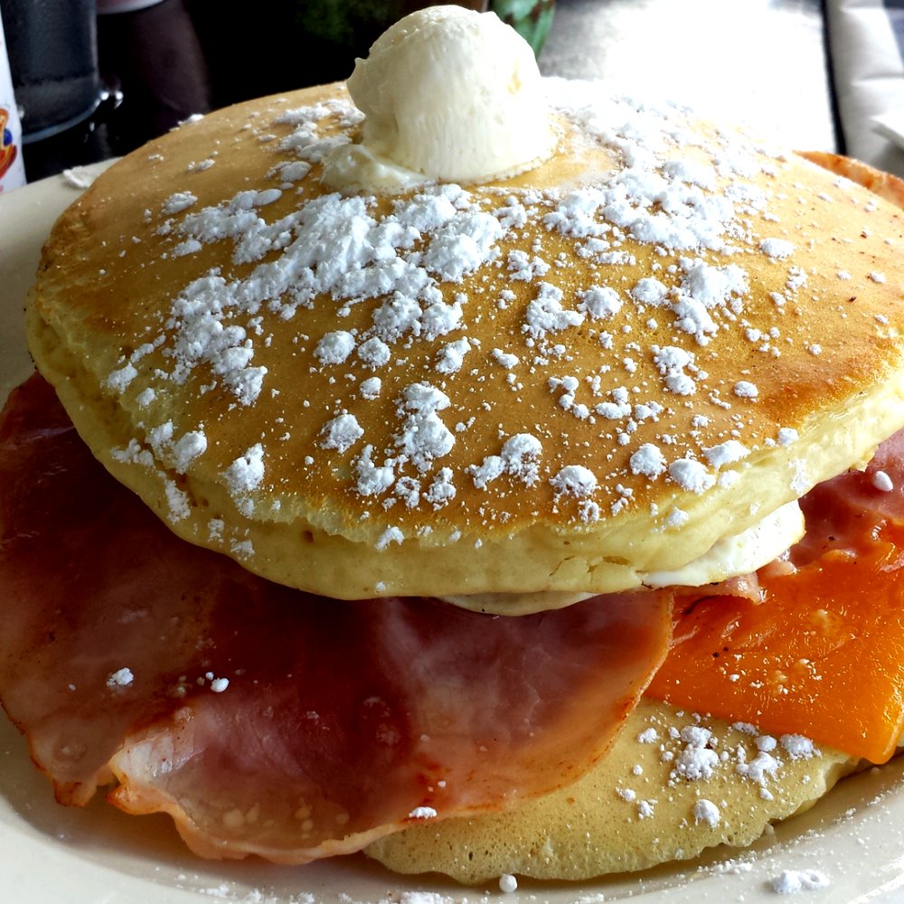 Pinky's - Pancake sando, 2 over medium eggs, ham, Swiss, cheddar between two buttermilk pancakes - Coffee & Tea Near Me - Tampa, Florida Pinky's - Pancake sando, 2 over medium eggs, ham, Swiss, cheddar between two buttermilk pancakes - Coffee & Tea Near Me - Tampa, Florida