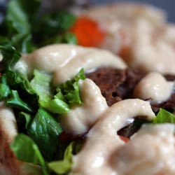 The Unicorn - East Coast Donair with house roasted donair meat, lettuce, tomato, diced onions, and house donair sauce