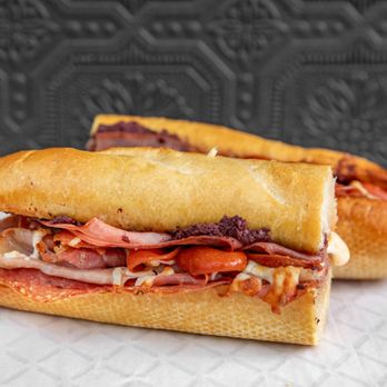 Spuntini Street Eats - ANTIPASTO SANDWICH

Salami, Pepperoni, Prosciutto, Mortadella, Olives, Pasta Sauce, Mozzarella on a Toasted Garlic Bread Loaf - Pizza Near Me - Toronto, Ontario