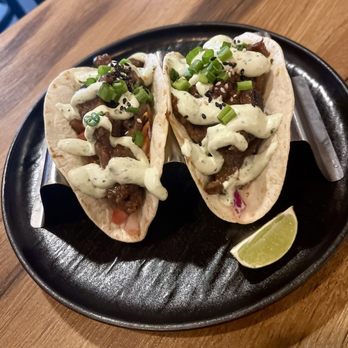 The Brick Kitchen + Lounge - Bulgogi tacos, Bulgogi beef, cabbage slaw, cilantro lime crema, pico de gallo - Beer Bar Near Me - Renton, Washington The Brick Kitchen + Lounge - Bulgogi tacos, Bulgogi beef, cabbage slaw, cilantro lime crema, pico de gallo - Beer Bar Near Me - Renton, Washington