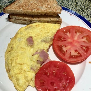 Pelican Cafe - Ham and Swiss omelet with wonderful tomatoes and rye toast. Among the BEST I've ever had! - American Near Me - Lake Park, Florida