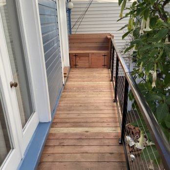 Dalton Construction - a deck with a bench and railing - General Contractors Near Me Dalton Construction - a deck with a bench and railing - General Contractors Near Me