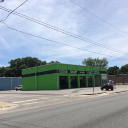 Chromeworx Custom Exhaust and Auto - Highly visible green auto shop on 98