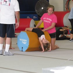 Kauai Gymnastics Academy - Using the gymnastics roller to increase flexibility.