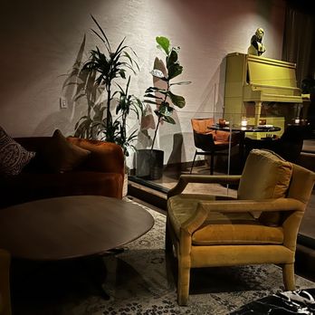 Mercy Me - a living room with a couch, chair, coffee table, and piano - New American Near Me - Washington, DC, District of Columbia Mercy Me - a living room with a couch, chair, coffee table, and piano - New American Near Me - Washington, DC, District of Columbia