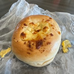 Egg, cheese, sausage bagel breakfast sandwich on feta bagel