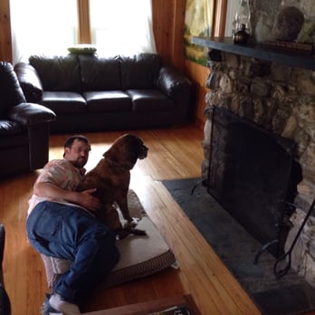 Gray Ghost Camps - Our dog willing the fireplace to light up - Hotels Near Me - Rockwood, Maine