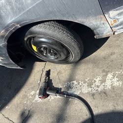 United Automotive Repair Center - Changing my donut for a used tire that cost me 55 bucks that has a nail and they have to repatch it. Ain't that some ish??