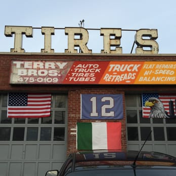 Terry Bros Tires - Signage and partial shot of the garage. - Tires Near Me - Patchogue, New York