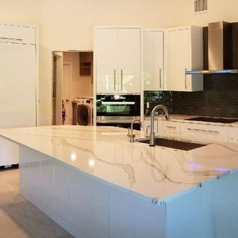 Mike's Magic - a kitchen with a marble island - General Contractors Near Me - Lee, Florida Mike's Magic - a kitchen with a marble island - General Contractors Near Me - Lee, Florida