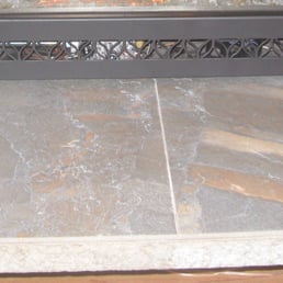 Cool porcelain hearth tiles from CFM, installed by AJ Tile & Stone from Kenmore.