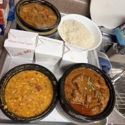 Flavors of India - Top left is the Goat Curry, bottom left is the yellow lentils and bottom right is Lamb Curry top right is rice