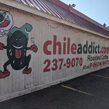 Chile Addict - a sign on the side of a building - Herbs & Spices Near Me - Albuquerque, New Mexico