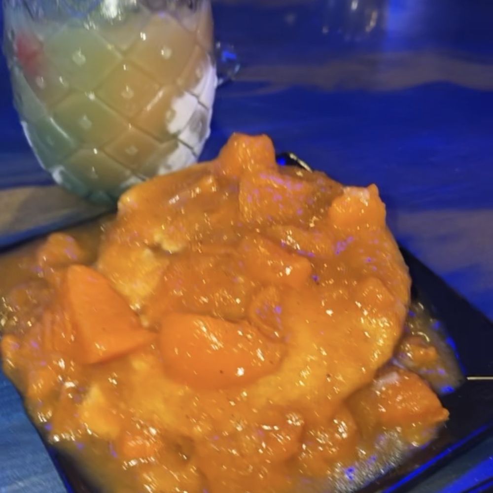 Godfreys - Cornbread smothered in yams - Caribbean Near Me - Flowood, Mississippi