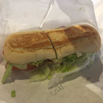 Cafecito - I ordered a jerk chicken sandwich. The look doesn't do justice for the taste. It was delicious! - Coffee & Tea Near Me - Chicago, Illinois