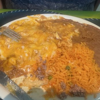 Mi Ranchito Mexican Grill - 17. Tejano Plate - cheese enchiladas in gravy, crispy beef taco (not pictured) rice, and beans. - Mexican Near Me - Killeen, Texas Mi Ranchito Mexican Grill - 17. Tejano Plate - cheese enchiladas in gravy, crispy beef taco (not pictured) rice, and beans. - Mexican Near Me - Killeen, Texas