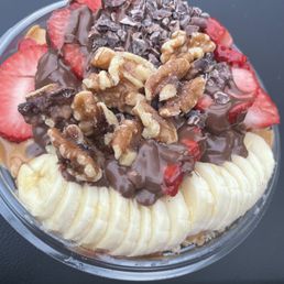 Custom: Mango & Pitaya base with strawberries, bananas, walnuts, chocolate & peanut butter sauce Custom: Mango & Pitaya base with strawberries, bananas, walnuts, chocolate & peanut butter sauce