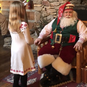 Earthshine Lodge - Santa enchanting a little girl. - Venues & Event Spaces Near Me - Lake Toxaway, North Carolina Earthshine Lodge - Santa enchanting a little girl. - Venues & Event Spaces Near Me - Lake Toxaway, North Carolina