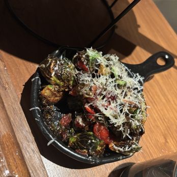 Ahumar - The Brussels sprouts, burst with a delightful contrast of sweetness from the cranberries, creating a savory-sweet harmony. - Seafood Near Me - Miami, Florida
