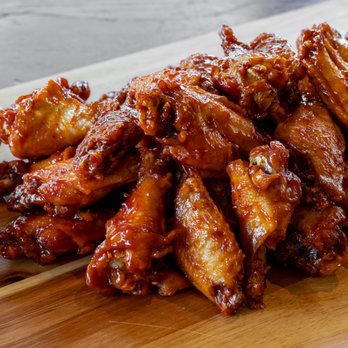 The Wing Experience - a pile of chicken wings on a cutting board - Chicken Wings Near Me - Tarentum, Pennsylvania The Wing Experience - a pile of chicken wings on a cutting board - Chicken Wings Near Me - Tarentum, Pennsylvania