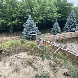 Premier Pools and Spas - Under all those weeds is the garbage they left behind to include lots of cigarette butts, beer bottles, and pieces of rebar and wood.