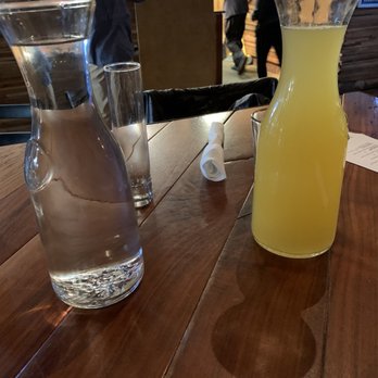 Heist Brewery - Pineapple Mimosa and Water carafe - New American Near Me - Charlotte, North Carolina Heist Brewery - Pineapple Mimosa and Water carafe - New American Near Me - Charlotte, North Carolina