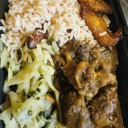 Caribbean Superior - Oxtails Rice & Peas along with cabbage