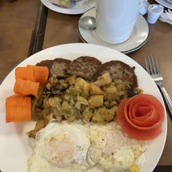 Coopersburg Bagels & Deli - This was the three egg platter, complete with home fries, onions and peppers and sausage. The floral decorations were carrots and apples.