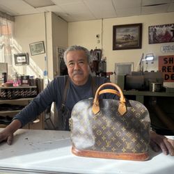 Most Popular Shoe Repair - Mr. Javier Barrios and our repaired Louis Vuitton.