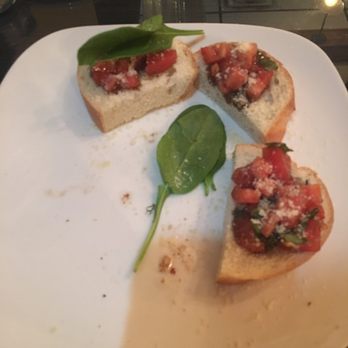 Mezzaluna II - Half eaten bruschetta. - Italian Near Me - Statesville, North Carolina Mezzaluna II - Half eaten bruschetta. - Italian Near Me - Statesville, North Carolina