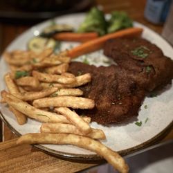 Ozzie's Restaurant Bar - Argentinian Milanesa with fries and grilled vegetables.
